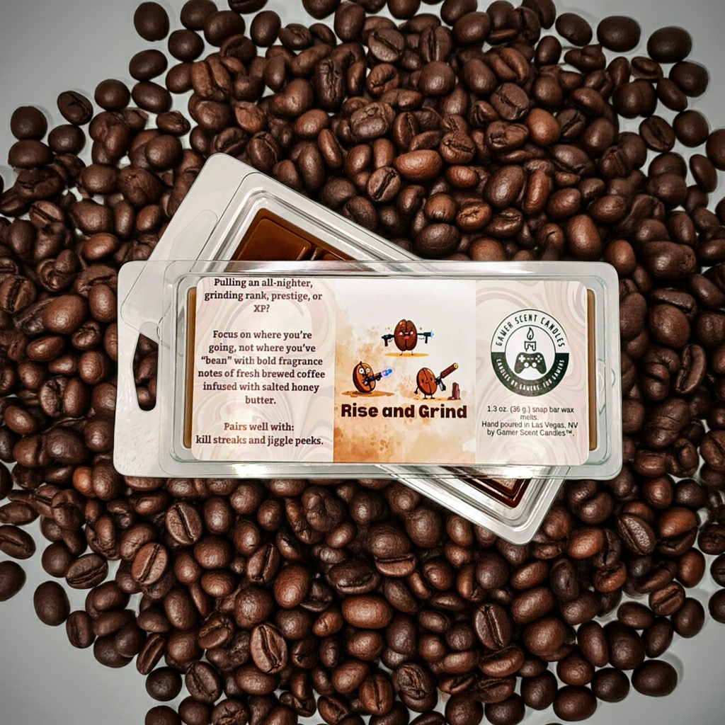 Rise and Grind snap bar wax melts, sitting on a pile of coffee beans. Front and back, stacked, slightly offset.  Video game wax melts. Perfect gift for gamers. Premium soy wax scented wax melts. Wax tarts.