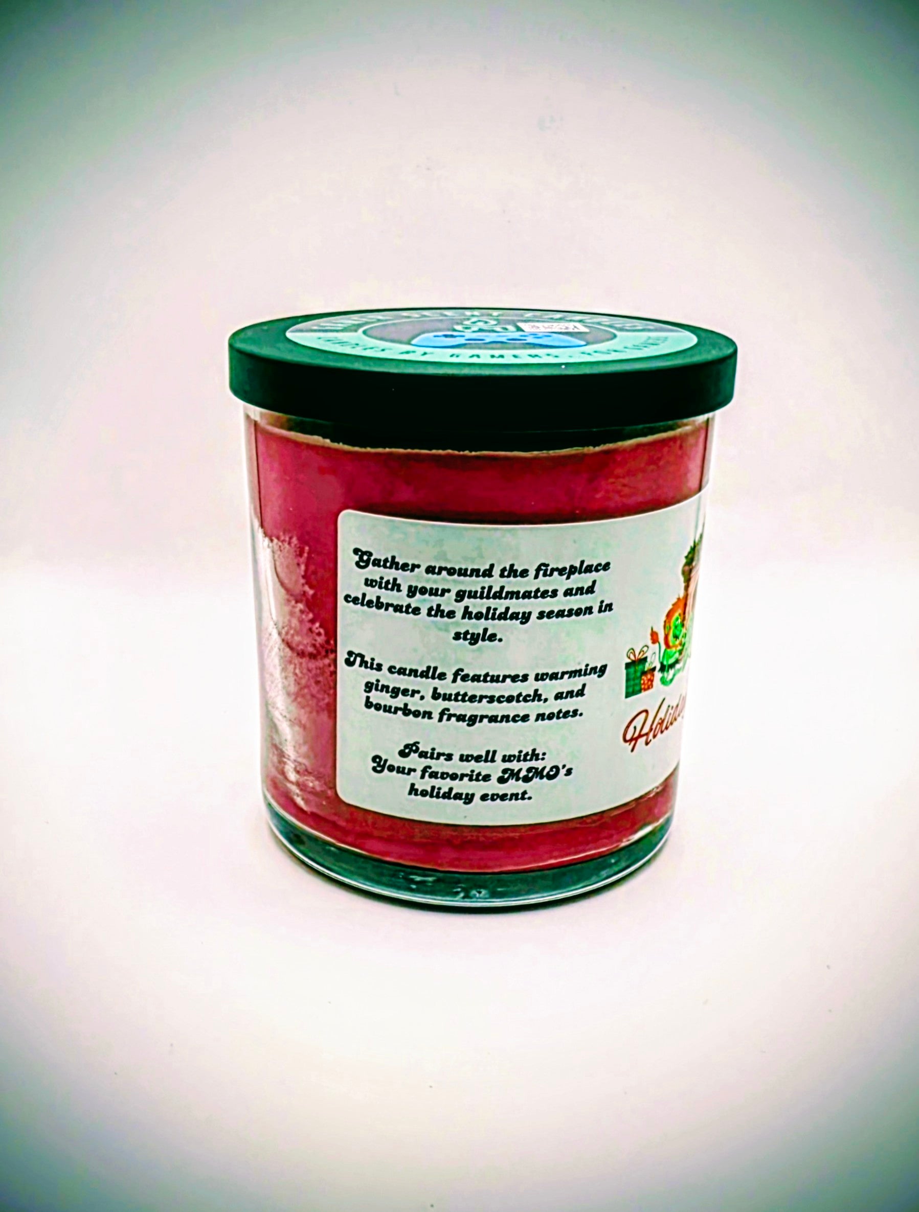 A 9 oz. candle in a glass tumbler jar named "Holiday Hearth". The label features a festive gathering of orcs around a fireplace during the holiday season.