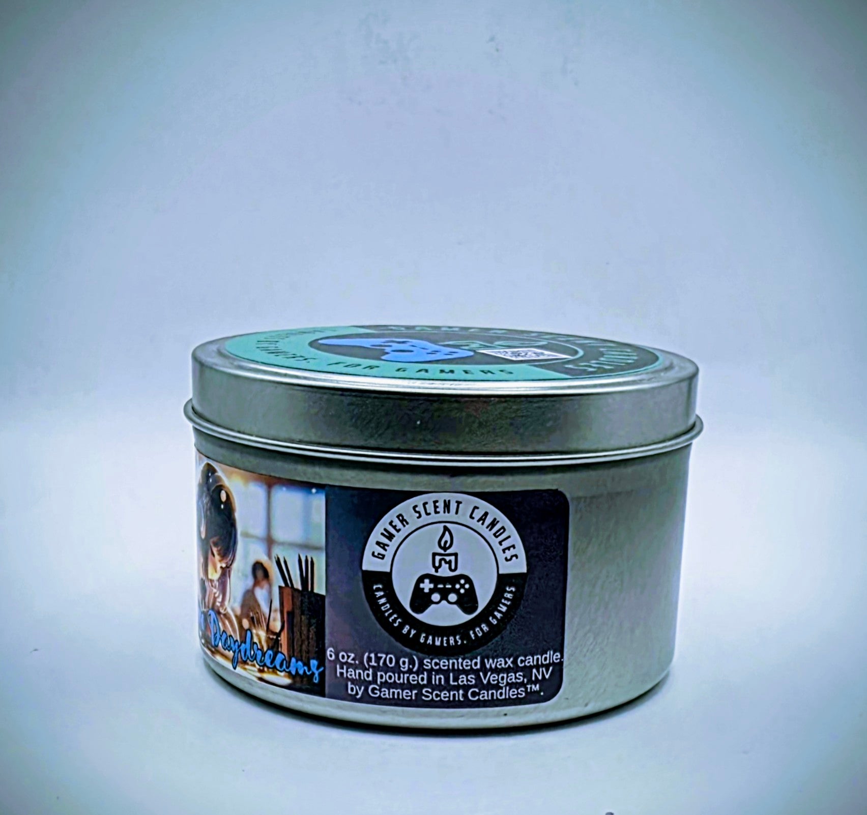 Our "Japanese Daydreams" candle in a 6 oz. tin. The candle features Sakura (cherry blossom) and plum fragrance notes. The candle is purple and features a purple label with a young Japanese girl wearing headphones, daydreaming during class. Our 6 oz. candles have approximately a 25 hour burn time.