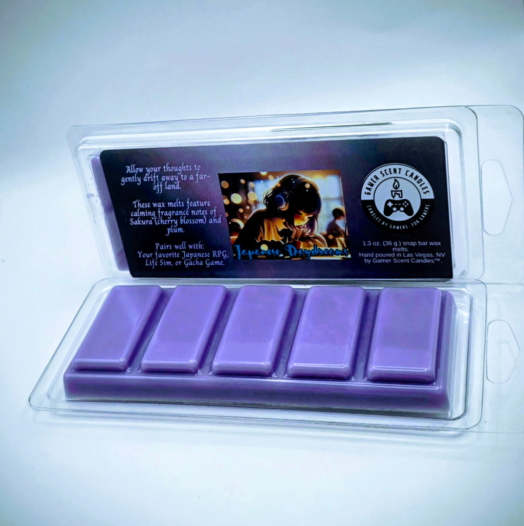 our Japanese Daydream snap bar wax melts feature calming fragrance notes of Sakura (cherry blossom) and plum. The purple label features a young Japanese girl, wearing headphones, while she daydreams in class.