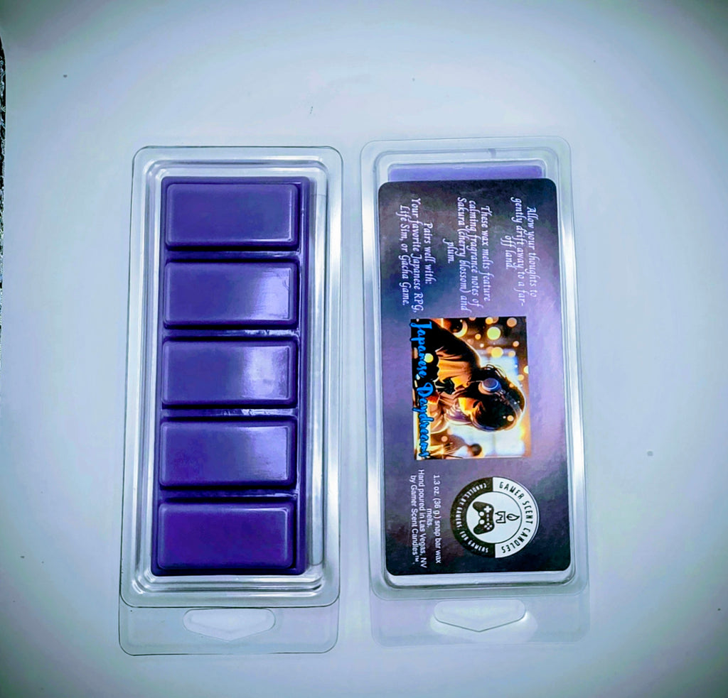 our Japanese Daydream snap bar wax melts feature calming fragrance notes of Sakura (cherry blossom) and plum. The purple label features a young Japanese girl, wearing headphones, while she daydreams in class.