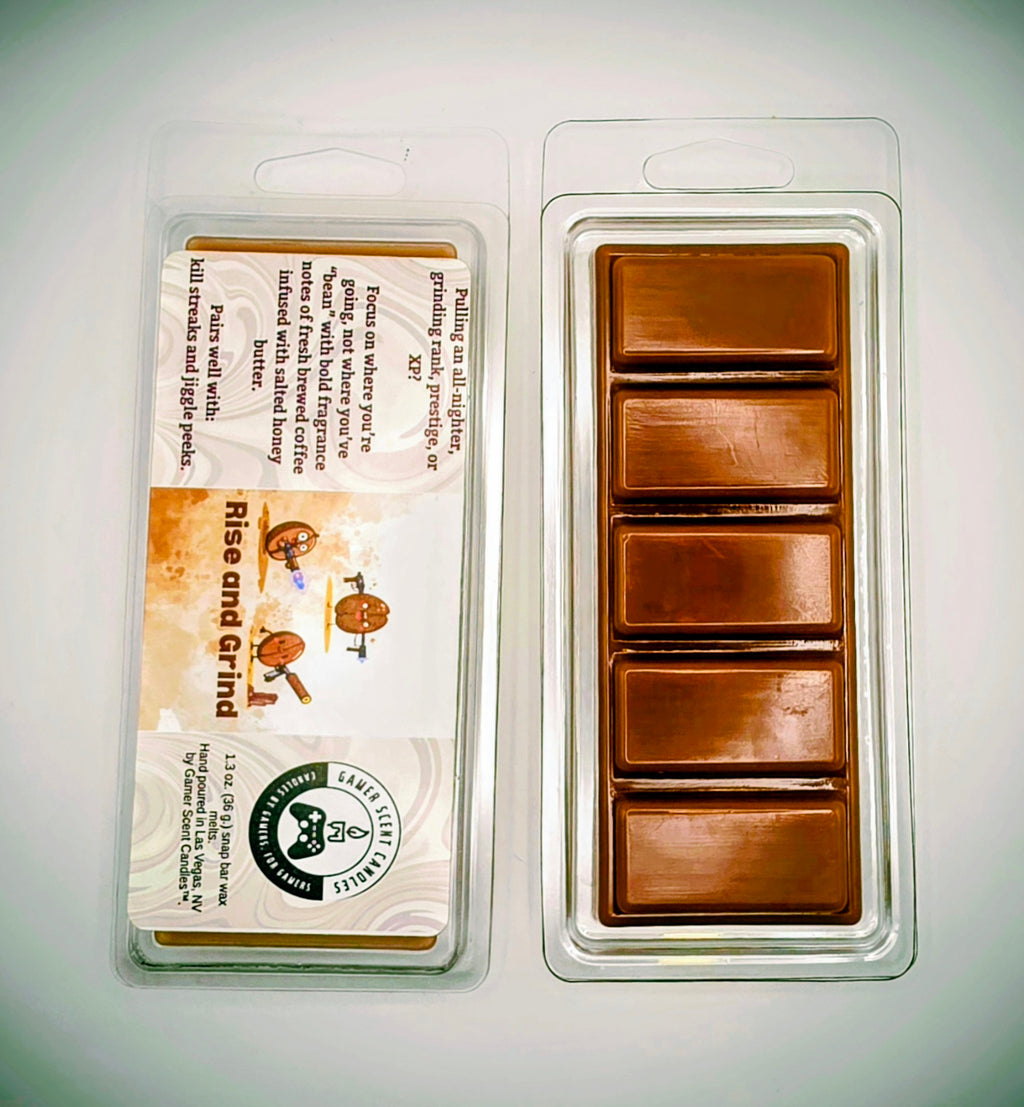 Our "Rise and Grind" scent in a 1.3 snap bar wax melt. It features fragrance notes of fresh brewed coffee, infused with scented honey butter. The label features cartoon coffee beans with weapons.